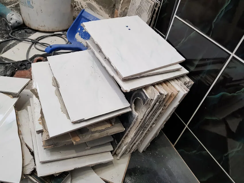 Close-up of 9x9 asbestos floor tiles showing potential asbestos contamination