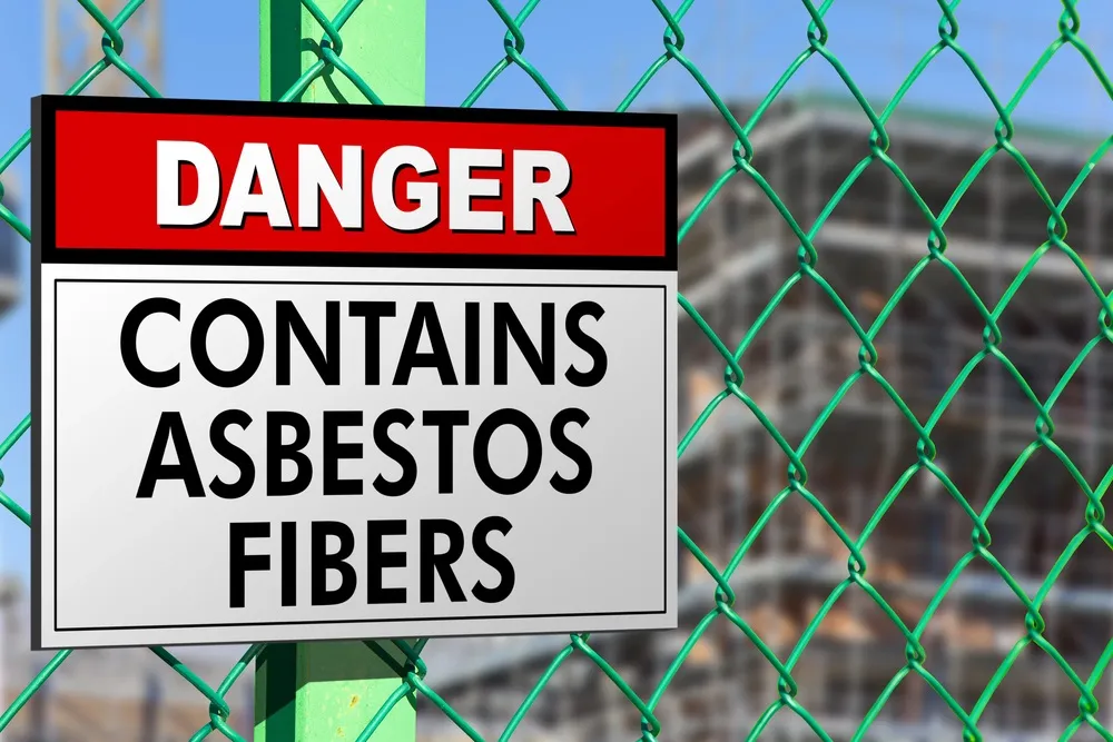 Danger sign on a fence warning DIY asbestos people that the area is unsafe